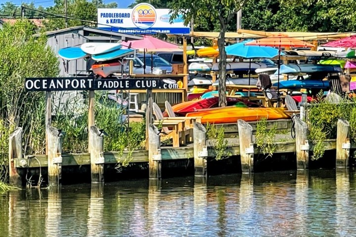 a group of lawn chairs sitting on top of a river