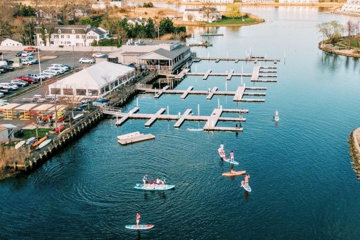 a small boat in a harbor next to a body of water