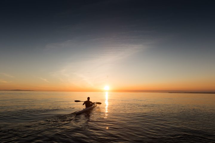 a sunset over a body of water