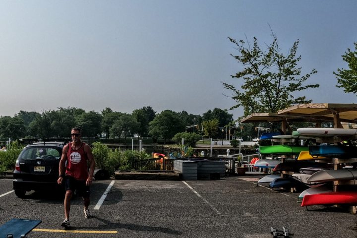 a group of people standing in a parking lot