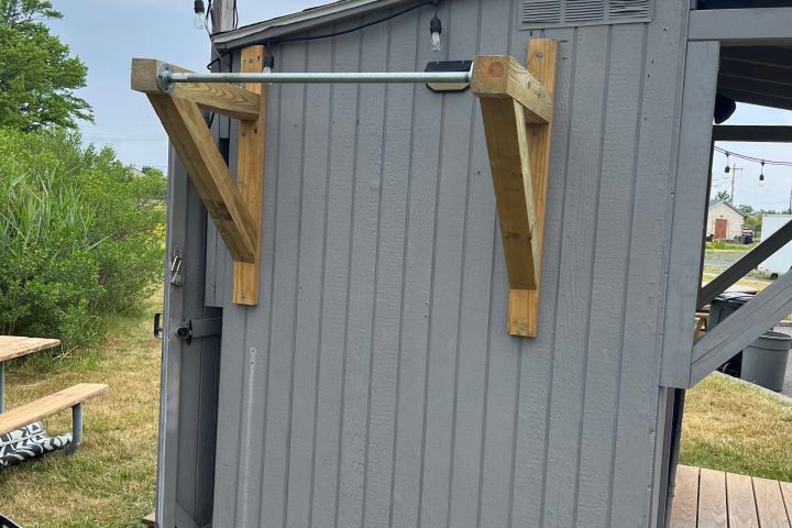 a building with a wooden fence