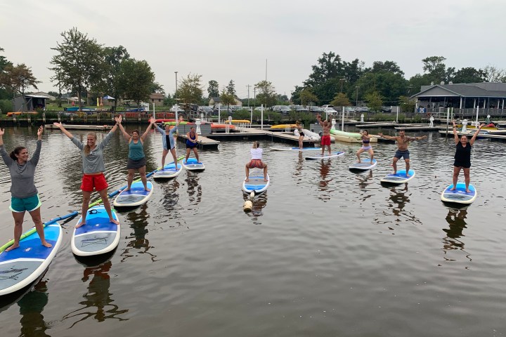 a group of people in a boat on a body of water